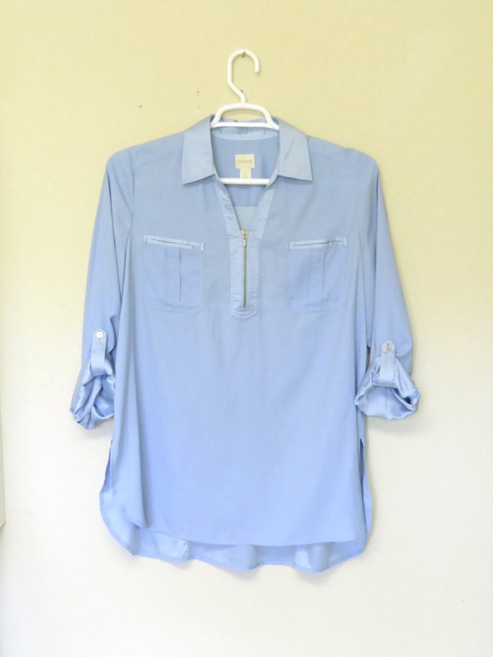 Chico’s light blue satin quarter zip roll tab sleeve blouse size 2 / Large